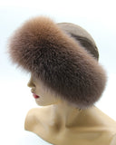 Left profile of Yaroslavna fur hat with brown suede crown behind the fox band