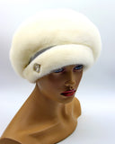 White mink beret hat three-quarter left view showing dense fur pile and clean undecorated silhouette