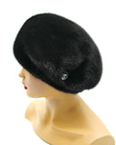 Black mink beret gathered tucks right profile view showing fur depth and tuck shadow detail