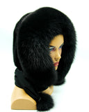 Black mink fur hood scarf wrap with polar fox trim worn by woman, front three-quarter view