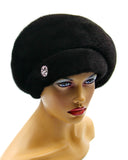 Black mink fur beret left side profile view showing rounded dome crown shape and natural fur sheen