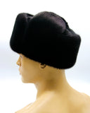 Side view black mink and suede ushanka earflaps up
