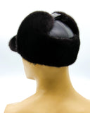 Front view man wearing black mink and leather bill ushanka