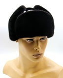 Close front view man wearing mink leather ushanka