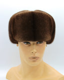 Man wearing pastel mink fur hat ushanka front earflaps tied up