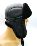 Side profile black mink fur hat and leather bomber ushanka