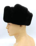 Black mink ushanka worn with earflaps down for cold weather