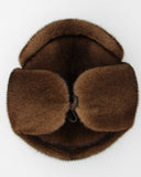 Overhead view pastel mink fur hat ushanka circular fur pattern