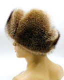 Angled view raccoon fur ushanka earflaps secured down