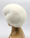 White mink fur beret gathered construction back view showing full tuck distribution across crown