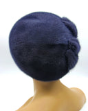 Women's graphite mink beret left profile view showing applique flower detail and fur texture